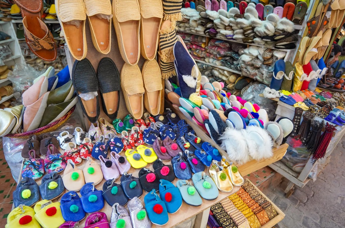Colorful display of slippers and shoes at a market stall